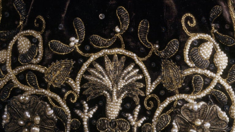 A close-up image of a black purse in the collection at Fenton House, featuring delicate beading.